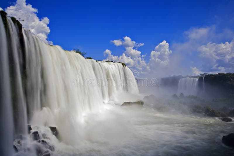 Iguassu Falls is the largest series of waterfalls on the planet, located in Brazil, Argentina, and Paraguay in South America. During the rainy season one can see as many as 275 separate waterfalls cascading along the edges of 2,700 meters or 1.6 miles cliffs. Argentines spells this wonder, Ã¬IguazuÃ®, the Brazilians, Ã¬Igaucu.Ã® Both versions are globally correct and widely used. South America. Iguassu Falls is the largest series of waterfalls on the planet, located in Brazil, Argentina, and Paraguay in South America. During the rainy season one can see as many as 275 separate waterfalls cascading along the edges of 2,700 meters or 1.6 miles cliffs. Argentines spells this wonder, Ã¬IguazuÃ®, the Brazilians, Ã¬Igaucu.Ã® Both versions are globally correct and widely used. South America