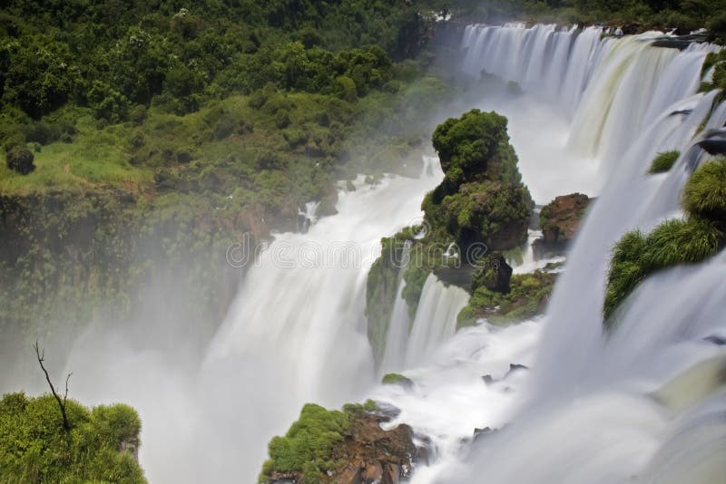 Iguassu Falls is the largest series of waterfalls on the planet, located in Brazil, Argentina, and Paraguay in South America. During the rainy season one can see as many as 275 separate waterfalls cascading along the edges of 2,700 meters or 1.6 miles cliffs. Argentines spells this wonder, Ã¬IguazuÃ®, the Brazilians, Ã¬Igaucu.Ã® Both versions are globally correct and widely used. South America. Iguassu Falls is the largest series of waterfalls on the planet, located in Brazil, Argentina, and Paraguay in South America. During the rainy season one can see as many as 275 separate waterfalls cascading along the edges of 2,700 meters or 1.6 miles cliffs. Argentines spells this wonder, Ã¬IguazuÃ®, the Brazilians, Ã¬Igaucu.Ã® Both versions are globally correct and widely used. South America