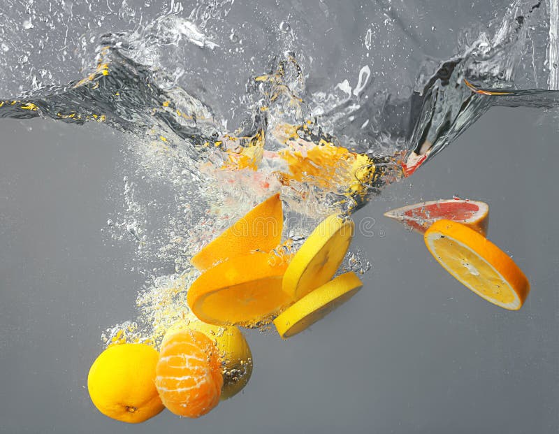 Fruits falling into water stock image. Image of grapes 10958107