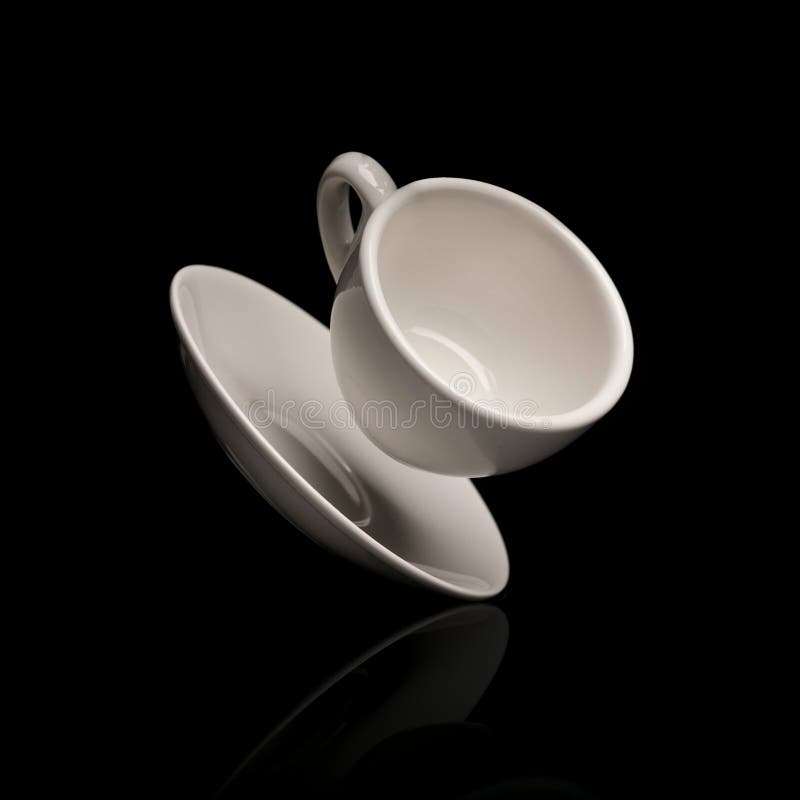 Falling coffee cup with saucer stock photo
