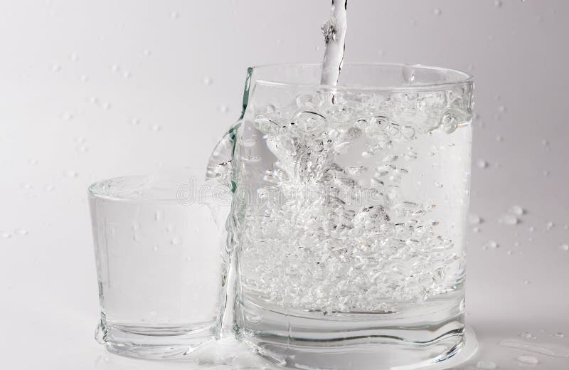 Falling and Crashing Glass of Water. Shards of Glass and Splashing Water Stock Photo Image of