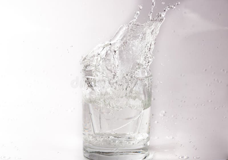 Falling and Crashing Glass of Water. Shards of Glass and Splashing Water Stock Photo Image of