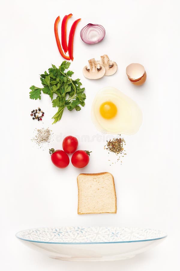 The Falling Ingredients of Fried Egg. Healthy Breakfast Ingredients