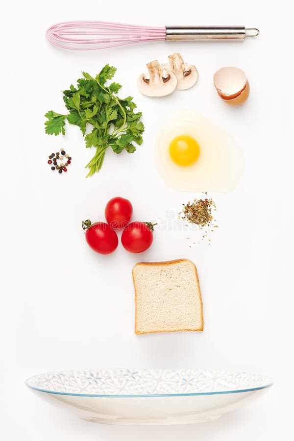 The Falling Ingredients of Fried Egg. Healthy Breakfast Ingredients