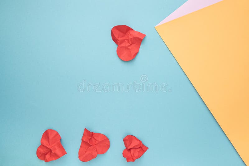Falling in Love Abstract Idea with Crumpled Paper Hearts Stock Photo