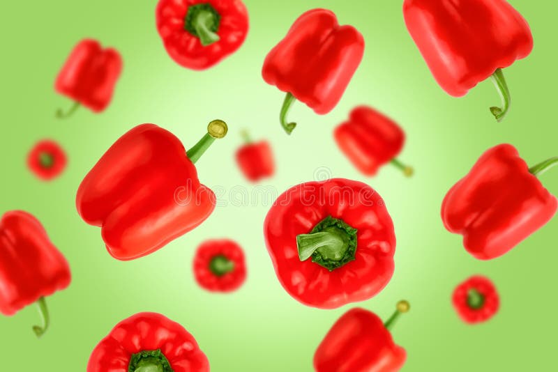 Falling Red Bell Peppers Isolated on a Green Background with Clipping