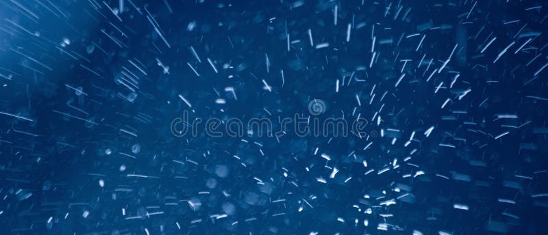 Falling snow - blue abstract background