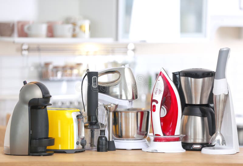 Household and kitchen appliances on table indoors. Interior element. Household and kitchen appliances on table indoors. Interior element