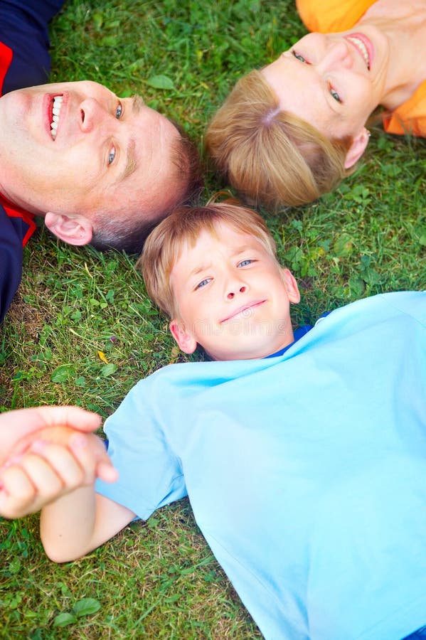 Happy family. Father, mother and sons in the park. Happy family. Father, mother and sons in the park