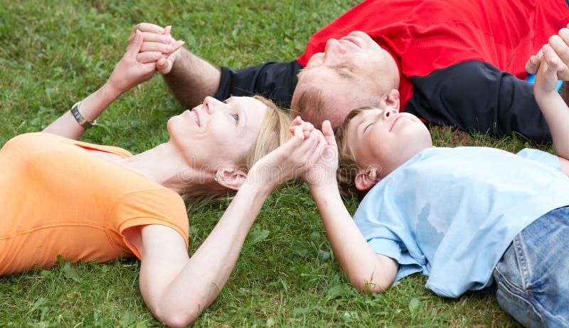 Happy family. Father, mother and sons in the park. Happy family. Father, mother and sons in the park