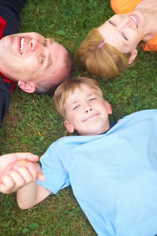 Happy family. Father, mother and sons in the park. Happy family. Father, mother and sons in the park