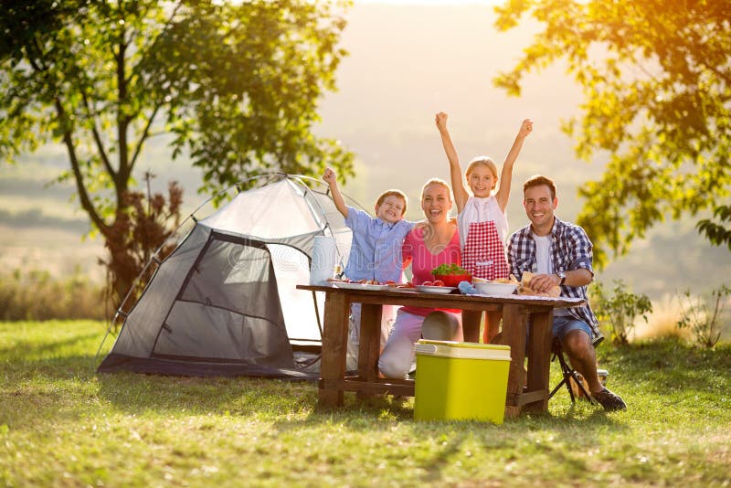 Happy family on camping at sunset. Happy family on camping at sunset