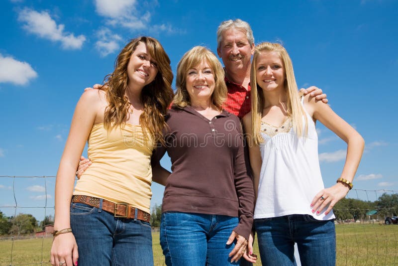 Grandparents and their beautiful teen granddaughters outside on the farm. Grandparents and their beautiful teen granddaughters outside on the farm.