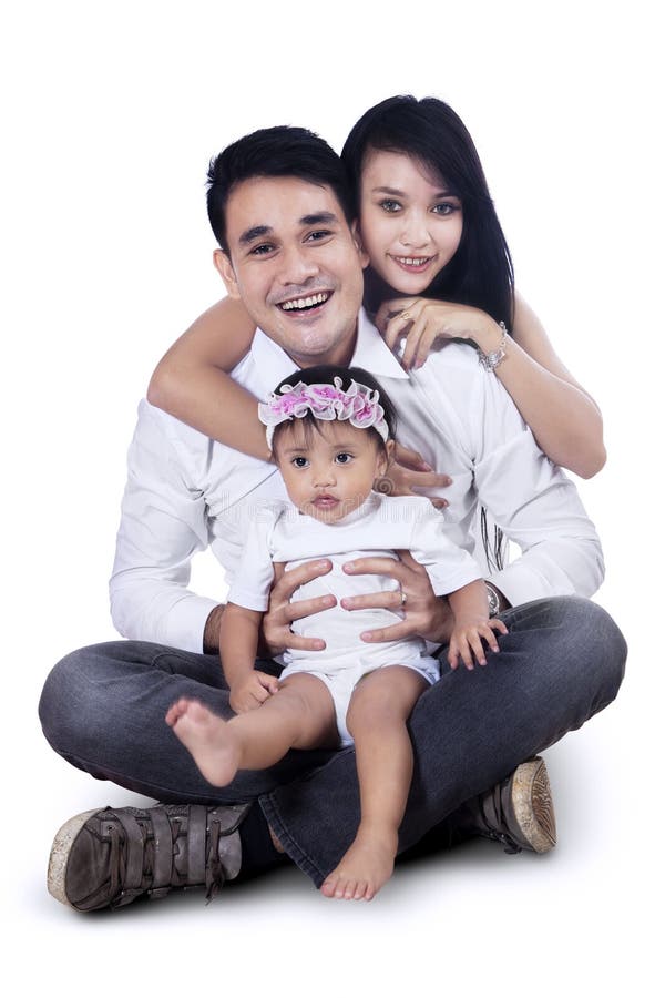 Familia joven feliz - aislada imagen de archivo Familia joven feliz - aislada imagen de archivo