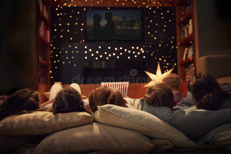 Family Enjoying Movie Night At Home Together. Family Enjoying Movie Night At Home Together