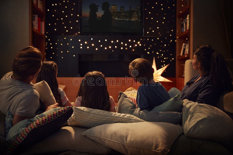 Family Enjoying Movie Night At Home Together. Family Enjoying Movie Night At Home Together