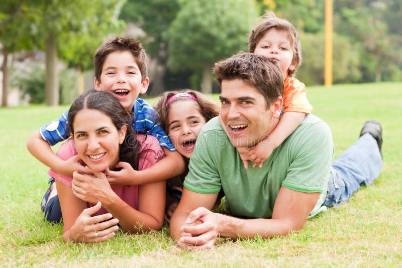 Family lifestyle portrait of a mum and dad having fun with their kids. Family lifestyle portrait of a mum and dad having fun with their kids