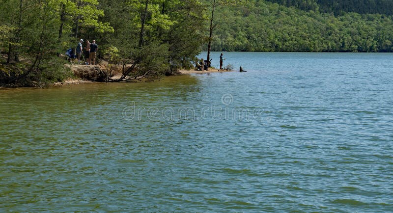 Botetourt County, Virginia USA: April 27th; Families enjoying fishing on the banks of Carvins Cove Reservoir located Carvins Cove Natural Reserve on April 27th, 2019, Botetourt County, Virginia, USA. Botetourt County, Virginia USA: April 27th; Families enjoying fishing on the banks of Carvins Cove Reservoir located Carvins Cove Natural Reserve on April 27th, 2019, Botetourt County, Virginia, USA.