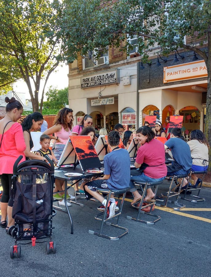 Americana on Park Avenue in Rutherford, NJ, USA: A local business holds a painting class on Park Ave., Rutherford, New Jersey, during the annual Summer Kick-Off, Cruisinâ€™ on the Avenue, which was scheduled to take place June 28th, 2016, but was postponed to June 29th due to inclement weather. Americana on Park Avenue in Rutherford, NJ, USA: A local business holds a painting class on Park Ave., Rutherford, New Jersey, during the annual Summer Kick-Off, Cruisinâ€™ on the Avenue, which was scheduled to take place June 28th, 2016, but was postponed to June 29th due to inclement weather.