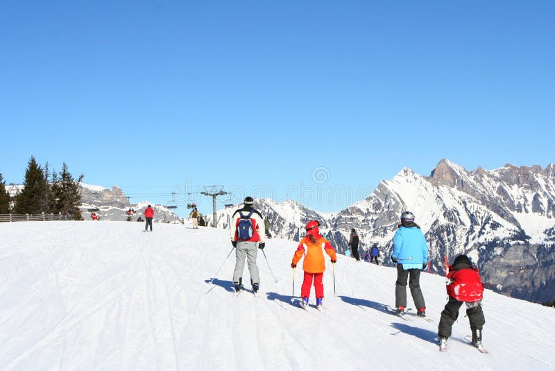 Families skiing in Alps