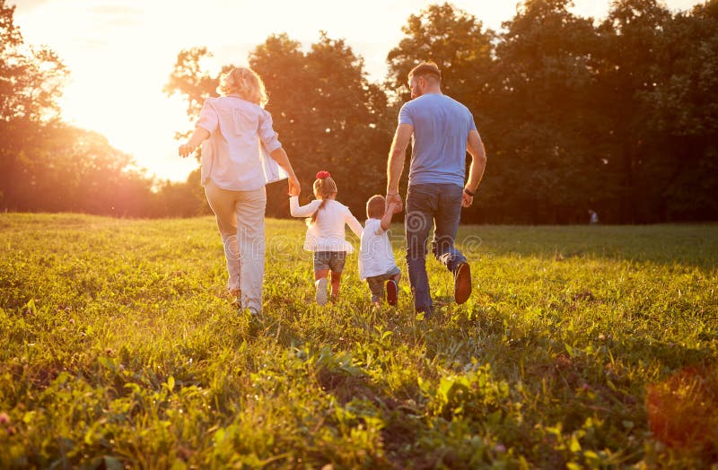 Family running together Family in nature, back view. Family running together Family in nature, back view