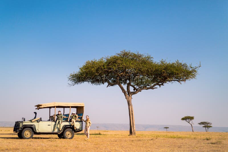 Family of mother and kids on African safari vacation enjoying morning game drive. Family of mother and kids on African safari vacation enjoying morning game drive