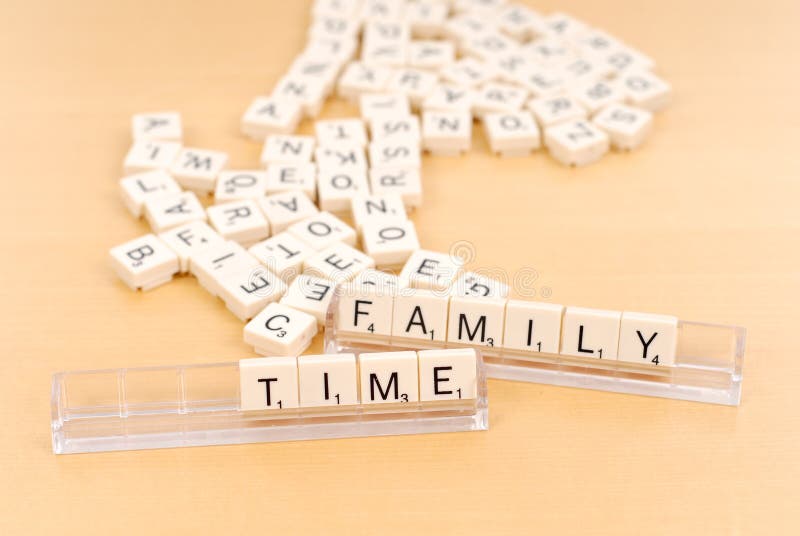 Family Time With Mixed Letter Tiles In Background. Family Time With Mixed Letter Tiles In Background