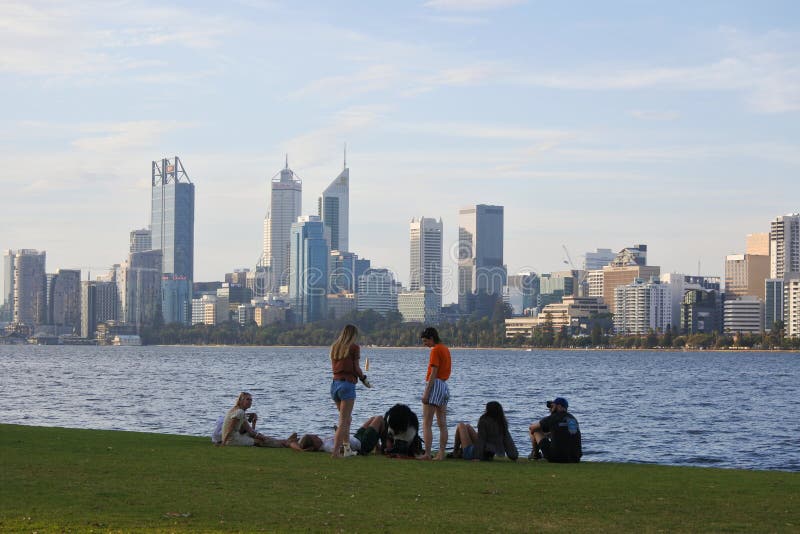 Australian family having a gathering on Swan River in Perth the capital city of Western Australia. Perth has an estimated population of over 1.7 million people. Australian family having a gathering on Swan River in Perth the capital city of Western Australia. Perth has an estimated population of over 1.7 million people