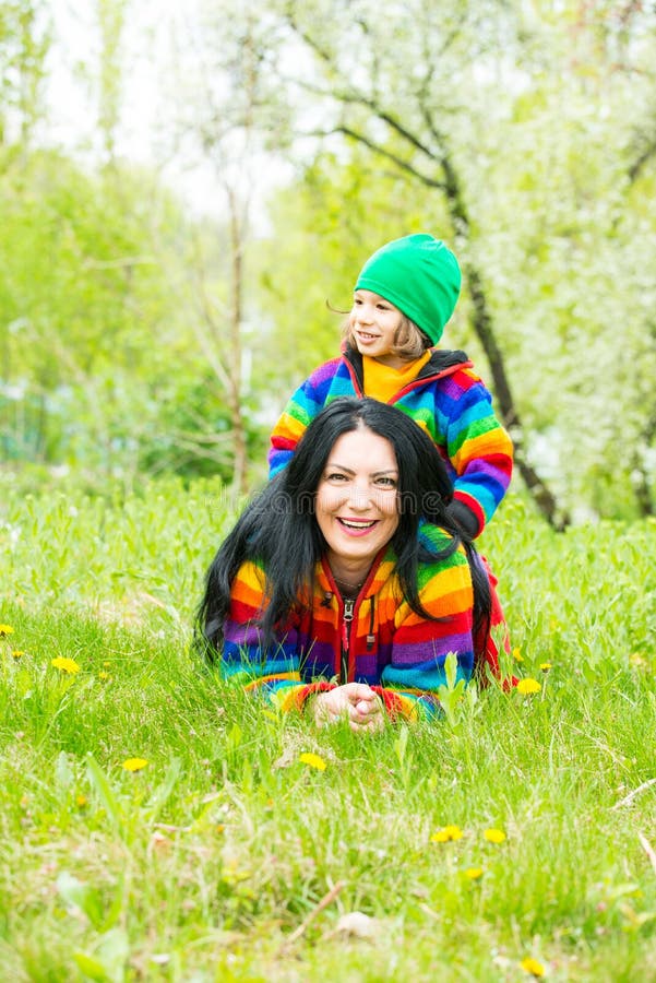 Mother and four years age boy having fun outdoor in spring park. Mother and four years age boy having fun outdoor in spring park