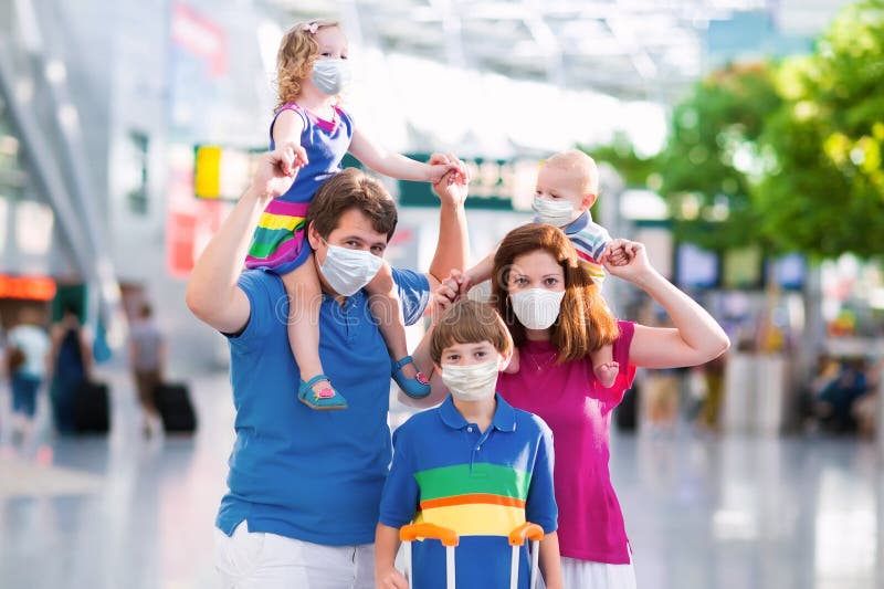 Family in airport in face mask. Virus outbreak stock photos Family in airport in face mask. Virus outbreak stock photos