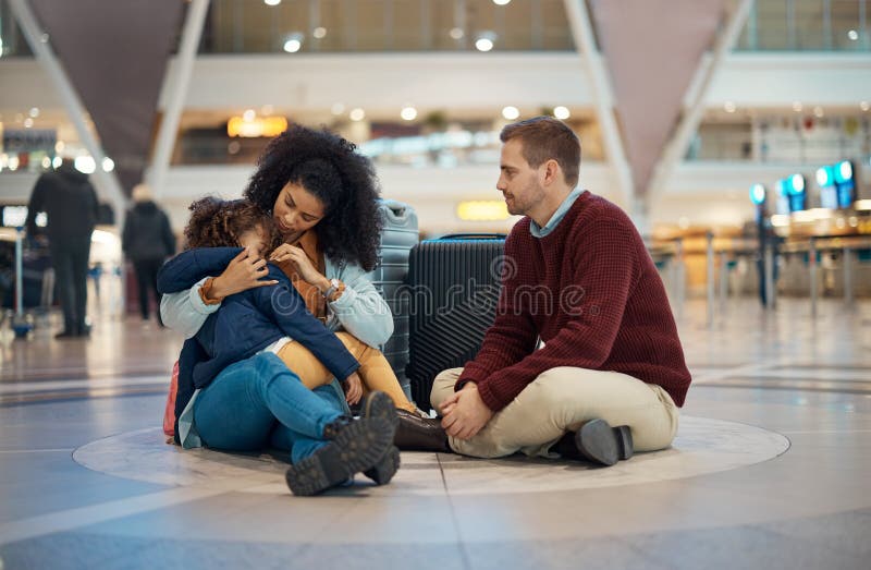 Family at an airport, father with mother hugging girl child and immigration farewell together. Travel with parents, mom