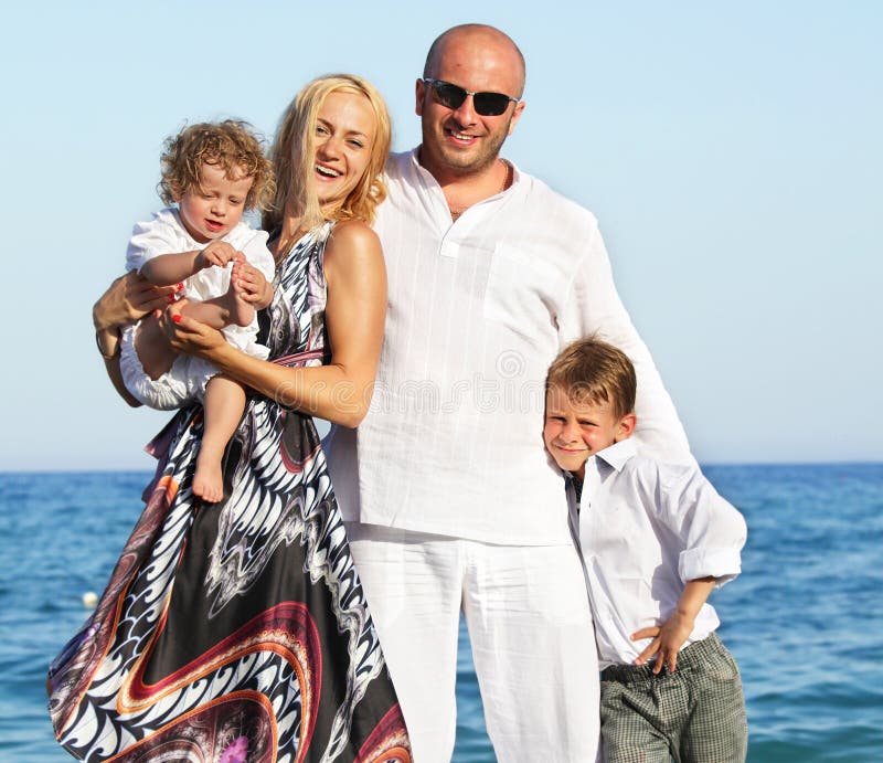 Family on beach royalty free stock image