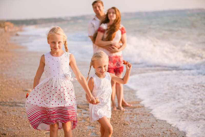 Family on the beach stock photos