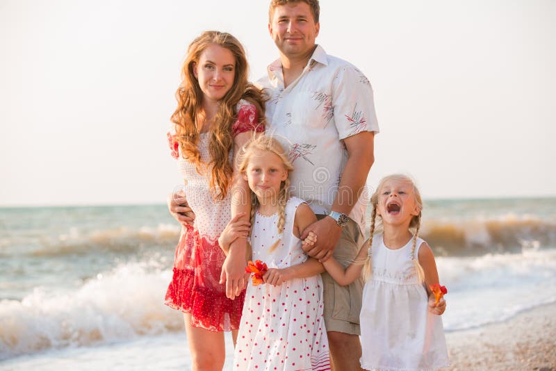 Family on the beach stock photos