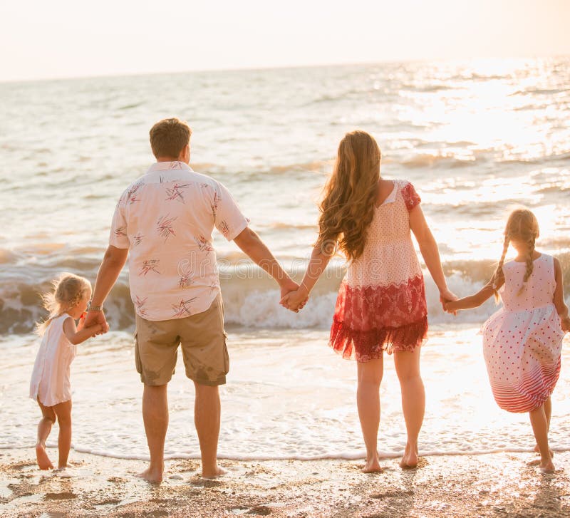 Family on the beach stock photo
