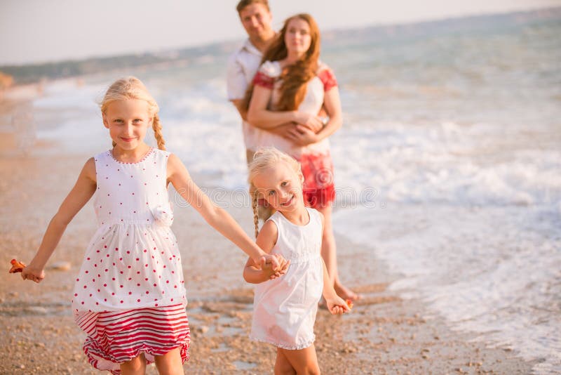 Family on the beach stock image