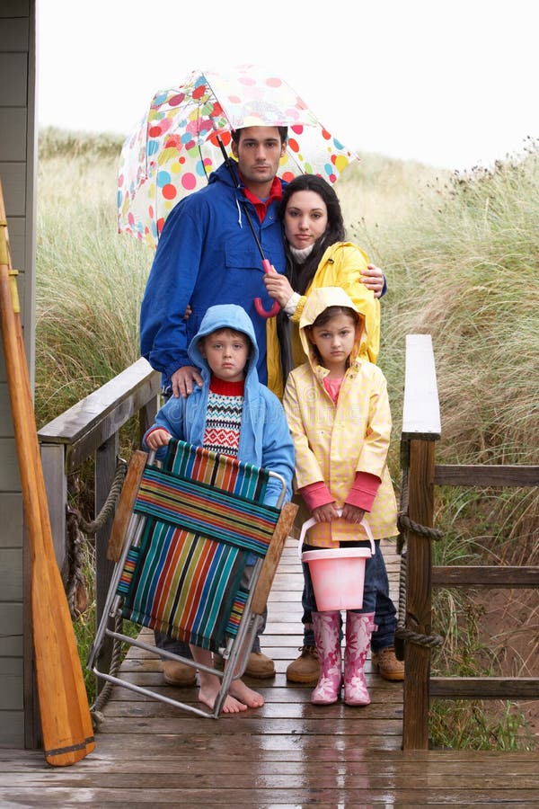 Family on Beach with Umbrella Stock Photo Image of umbrella, vertical