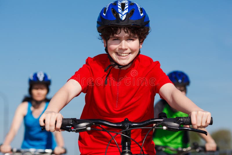 Active family - mother and kids biking. Active family - mother and kids biking