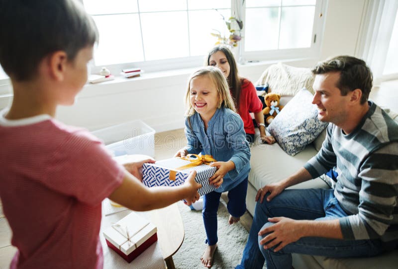 Family birthday party giving gift stock image Family birthday party giving gift stock image