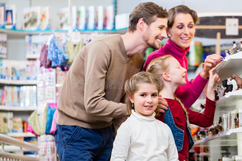 Family buying toys in toy store