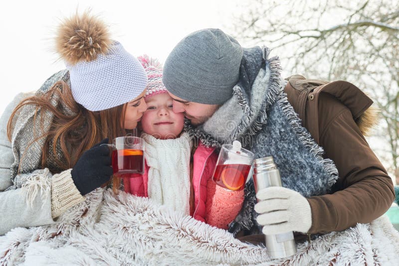 Family with child drinking tea