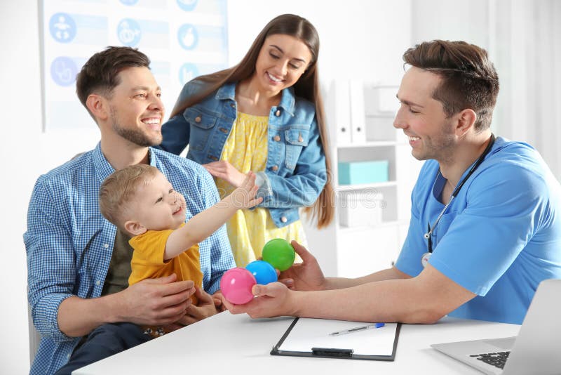 Family with child visiting doctor stock photos Family with child visiting doctor stock photos