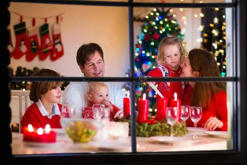 Family with children at Christmas dinner at home