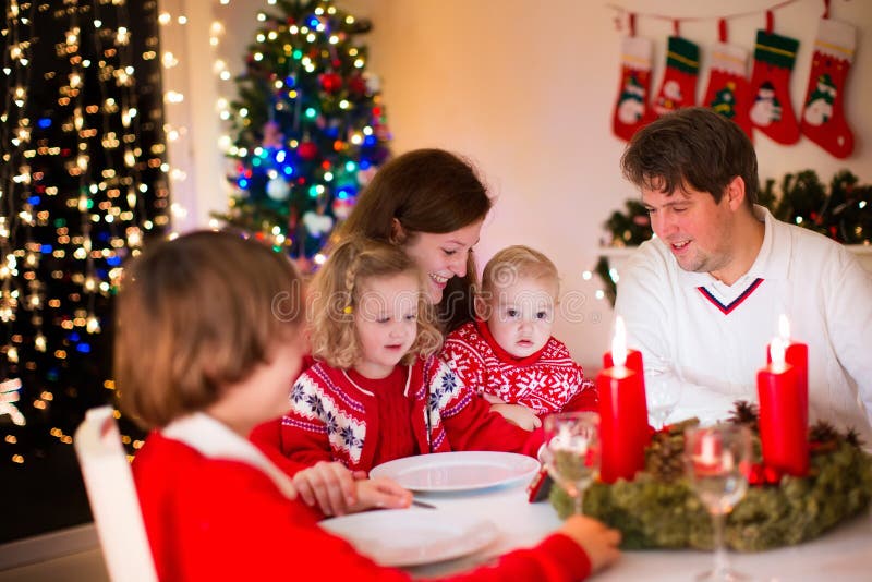 Family At Christmas Dinner At Home Stock Image - Image of decoration, advent: 61300513