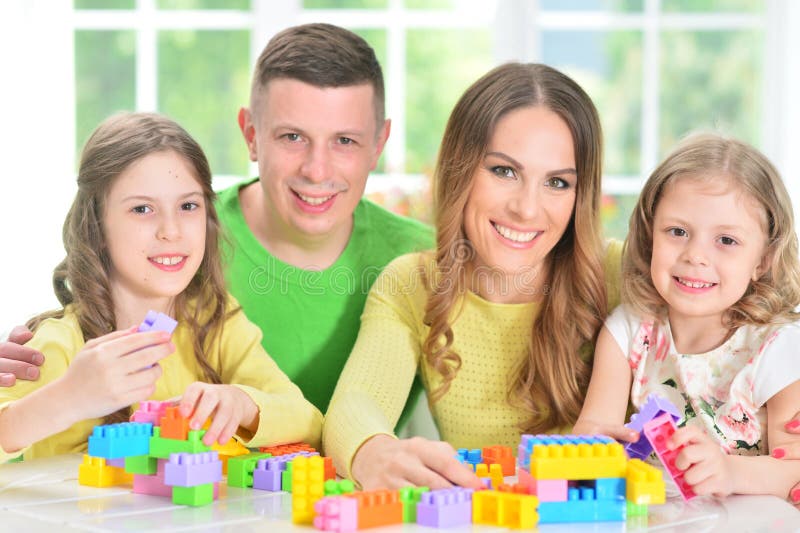 Family collecting blocks together