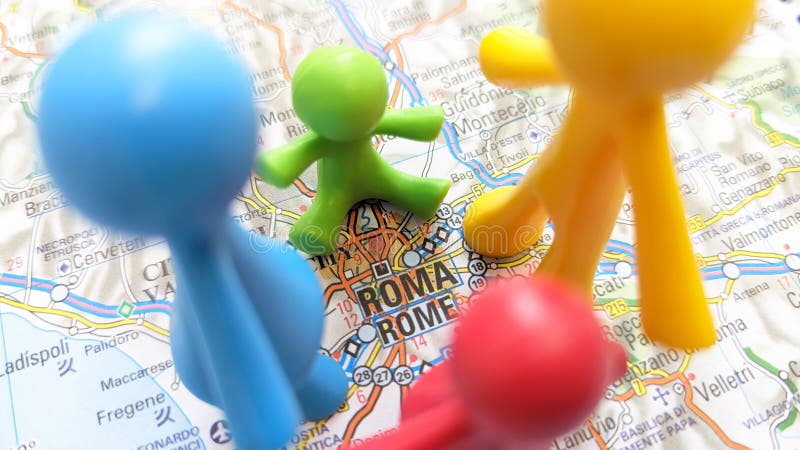 A family of colorful toy figures holding hands standing on Rome on a map of Italy