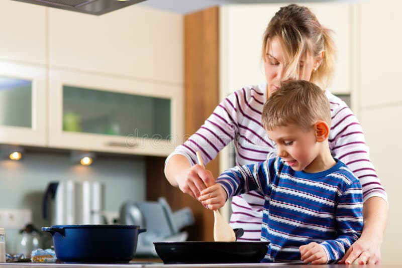 Family cooking in kitchen stock photo
