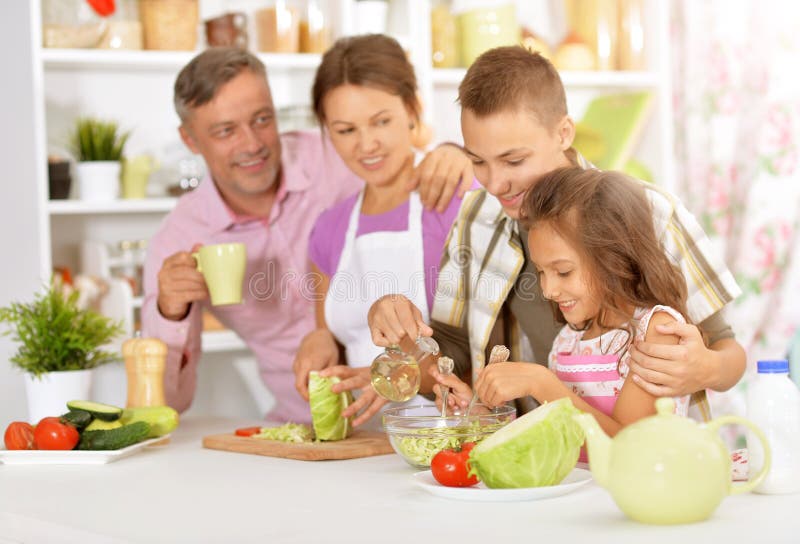 Family cooking salad stock photo. Image of home, happiness 95790712