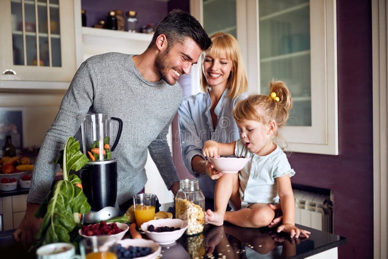 Family with Daughter Eating in Kitchen Stock Photo - Image of indoor ...