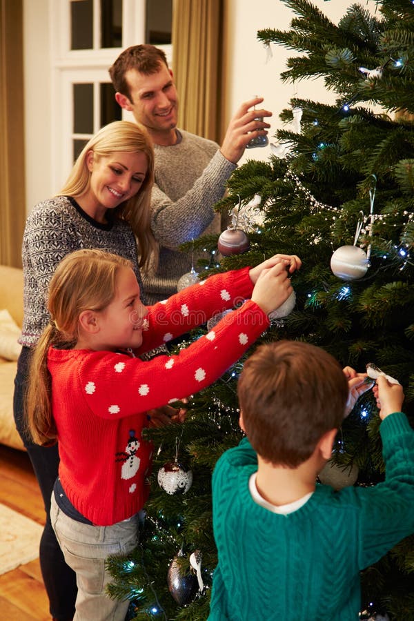 Family Decorating Christmas Tree at Home Together Stock Photo - Image ...